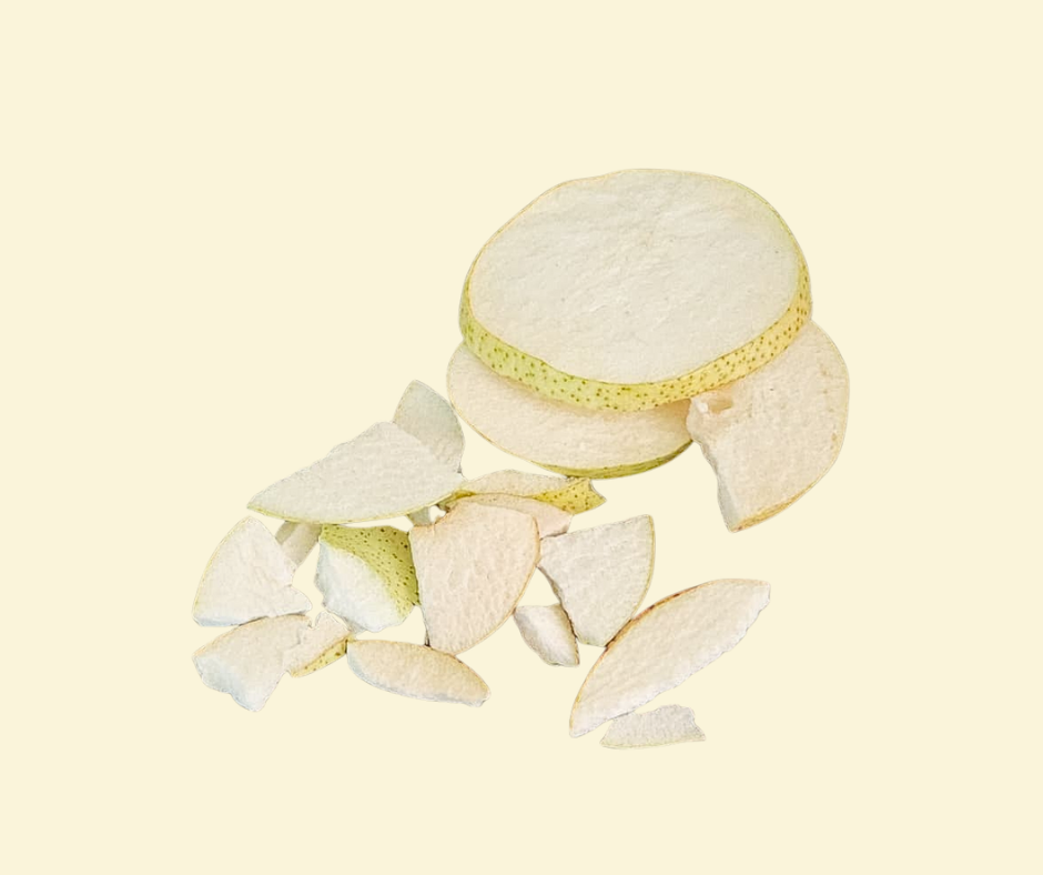 freeze dreid pear slices on a beige background