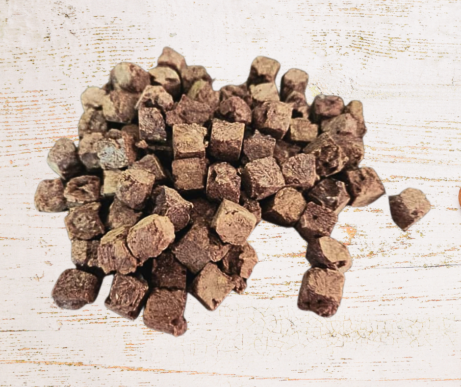 Brown cube-shaped objects on a light wooden surface