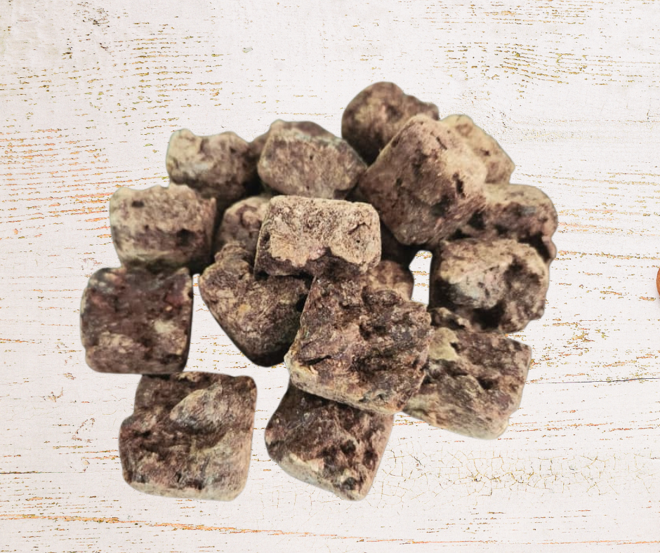 Brown pet treats on a textured white surface