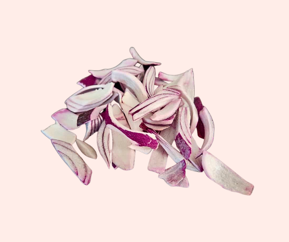 sliced red onion with pale pink background