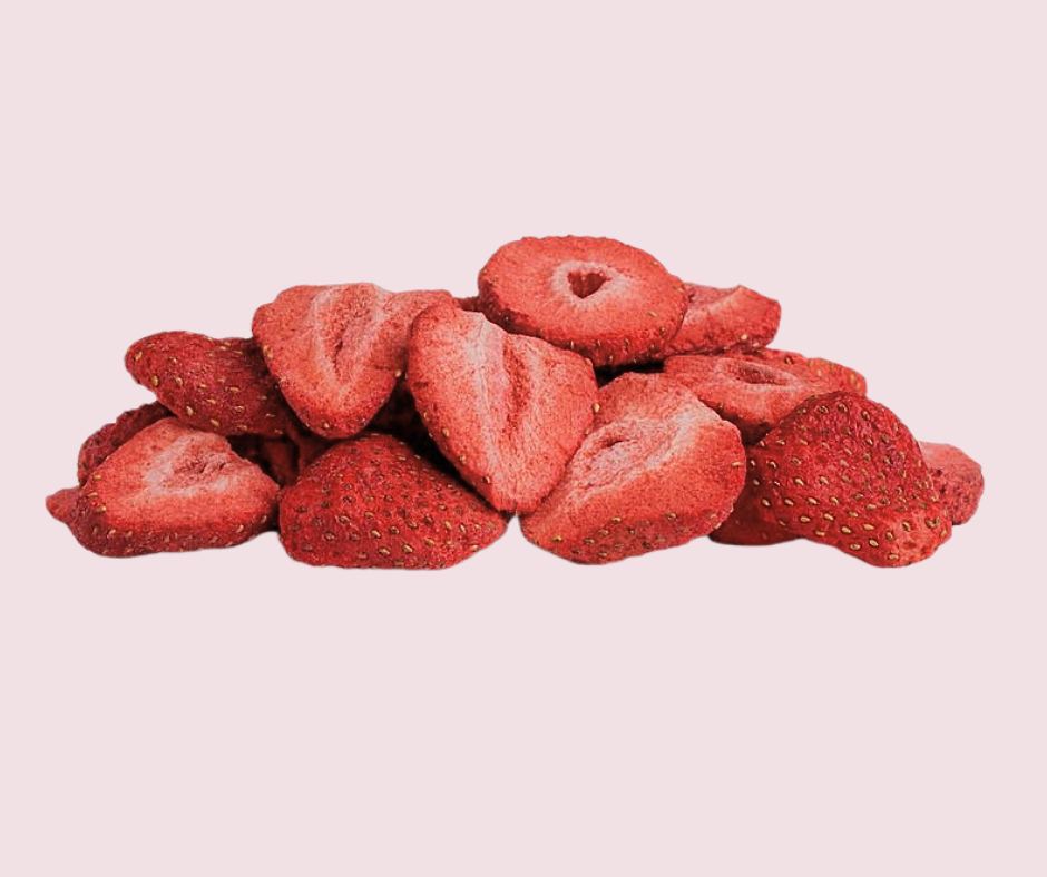freeze dried strawberries with pale pink background